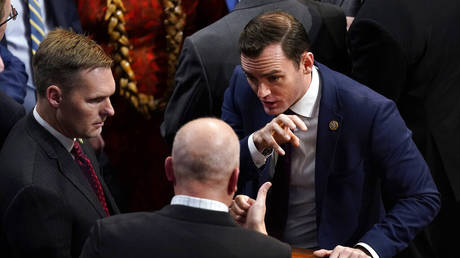 Rep. Mike Gallagher, R-Wis., right, talks with Rep. Chip Roy, R-Texas, in the House chamber as the House meets for a second day to elect a speaker and convene the 118th Congress in Washington, Wednesday, Jan. 4, 2023.