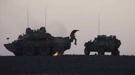 FILE PHOTO. A French soldier jumps from an AMX 10 RC vehicle during an operation in Mali.