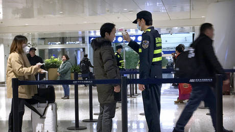 FILE PHOTO: Health screening checkpoint at Wuhan Tianhe International Airport in Wuhan in southern China's Hubei province.