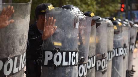 Riot police at an anti-government march on January 12, 2023, Cusco, Peru