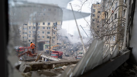 Emergency workers search the remains of a residential building in Dnepr, Ukraine.