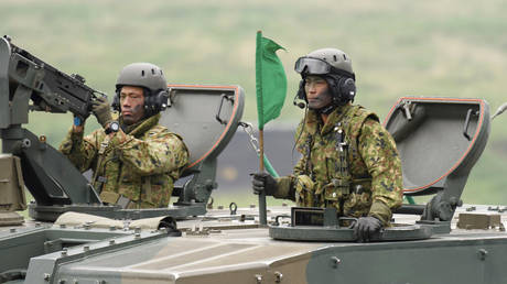 FILE - Japan's Ground Self-Defense Forces (JGSDF) soldiers at a live fire exercise in Gotemba, southwest of Tokyo, Saturday, May 22, 2021.