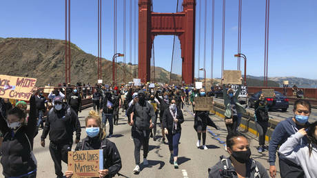 FILE PHOTO: Protesters march across the Golden Gate Bridge in support of the Black Lives Matter movement in San Francisco, June 6, 2020