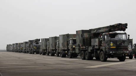 FILE PHOTO: A camouflage convoy of Dutch military trucks carrying two batteries of Patriot missiles in Vreedepeel, January 7, 2013