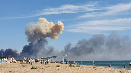 FILE PHOTO: Smoke is seen rising in the distance after explosions were heard near a Russian military base in Crimea, August 9, 2022