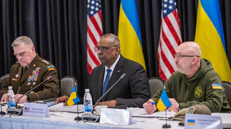 Chairman of the US Joint Chiefs of Staff Mark Milley (L), US Secretary of Defense Lloyd Austin (C) and Ukrainian Defense Minister Aleksey Reznikov (R) attend a meeting of the Ukraine Defense Contact Group on January 20, 2023.