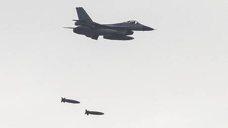 A Dutch F-16 aircraft drops bombs during a NATO training mission in Vlieland, Netherlands, 2020.