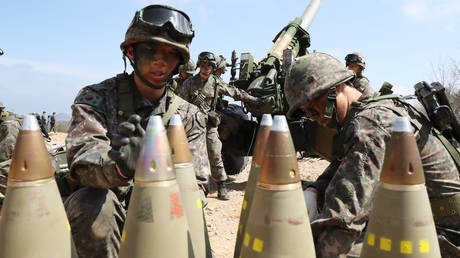 FILE PHOTO: South Korean army soldiers arrange 155mm howitzer shells during a military exercise in Goseong, South Korea, April 4, 2016