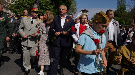 Ex-Moldovan President Igor Dodon (center) marches in the Victory Day parade last May in Chisinau. The event commemorates the Soviet victory over Germany in World War II.
