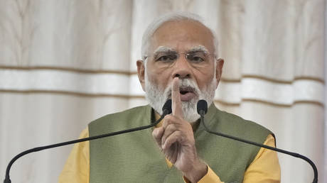 FILE PHOTO: Narendra Modi speaks during a public meeting ahead of Gujarat state legislature elections in Ahmedabad, India, December 2, 2022