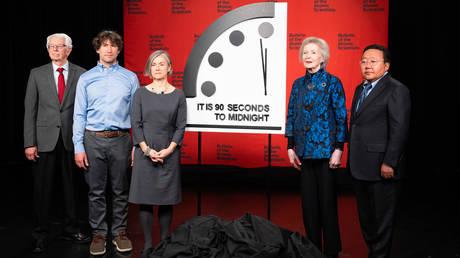 Members of the Bulletin of the Atomic Scientists unveil their updated Doomsday Clock on Tuesday in Washington.