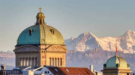 File photo: The dome of the Swiss parliament (Bundeshous) in Bern, with Mt. Eiger in the background