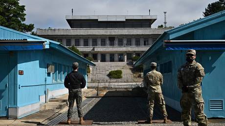 FILE PHOTO: South Korean and UN soldiers at the demilitarized zone that separates South Korea and North Korea, 2022.