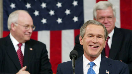 FILE PHOTO: US President George W. Bush (R) delivers his second State of the Union address as Vice President Dick Cheney (L) looks on January 28, 2003 at the Capitol building in Washington DC.