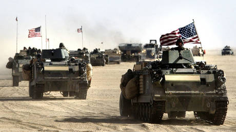 FILE PHOTO: US Army 11th Engineers attached to the 3-7 infantry move into position March 18, 2003 ahead of a possible military strike near the Kuwait-Iraq border.