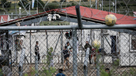 Asylum seekers arrested for crossing illegally from Türkiye to Greece remain in a detention on June 14, 2021 in Fylakio, Greece.