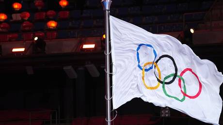 FILE PHOTO. International Olympic Committee flag  at the closing ceremony of  XXIV  Winter Olympic Games in Beijing