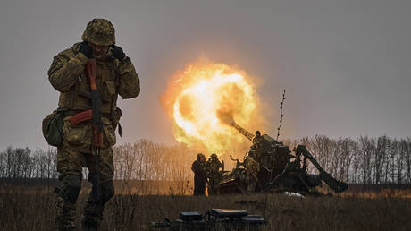 Ukrainian soldiers fire a Pion artillery system at Russian positions near Bakhmut, Donetsk region, Ukraine, Friday, Dec. 16, 2022.