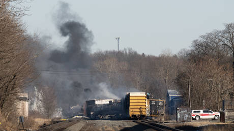 Smoke rises from a derailed cargo train in East Palestine, Ohio.