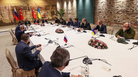 FILE PHOTO: Turkish Foreign Minister Mevlut Cavusoglu (C) gives a thank you speech during the peace talks between delegations from Russia and Ukraine at Dolmabahce Presidential Office in Istanbul, Turkiye on March 29, 2022.