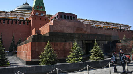 Police officers guard outside the mausoleum of Soviet State founder Vladimir Lenin at Red Square, in Moscow, Russia.