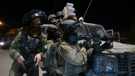 Members of the Israel Defense Forces (IDF) and Shin Bet are seen during a raid on a Palestinian refugee camp in Jericho, a city in the occupied West Bank, February 6, 2023.