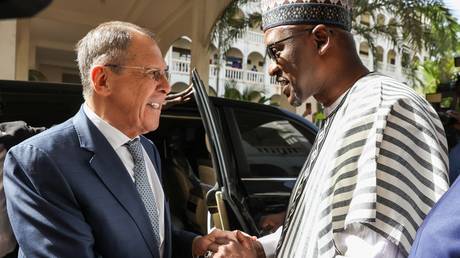 Foreign Minister Abdoulaye Diop of Mali greets his Russian counterpart Sergey Lavrov before their meeting in Bamako