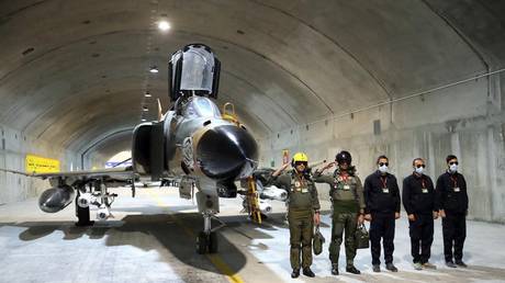 Iranian Army pilots attend the unveiling of the country's first underground fighter jet base at an undisclosed location in Iran, February 7, 2023