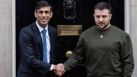 British Prime Minister Rishi Sunak (L) welcomes Ukrainian President Volodymyr Zelensky outside 10 Downing Street ahead of their meeting in London, United Kingdom on February 08, 2023.