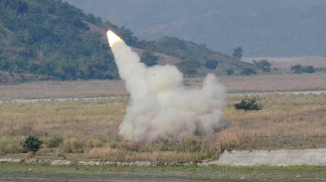 FILE PHOTO. A US-made HIMARS launcher is fired during an exercise.
