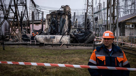 FILE PHOTO: Workers in Ukraine dismantle a destroyed autotransformer