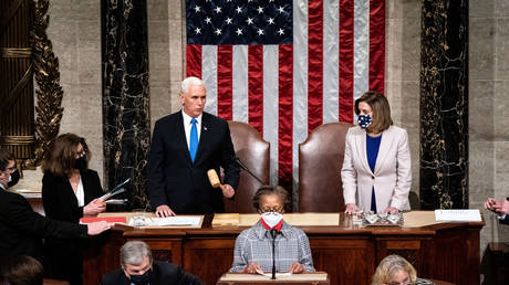 Mike Pence and Speaker of the House Nancy Pelosi preside over a joint session of Congress on January 6, 2021