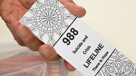 A bookmark with the 988 suicide and crisis lifeline emergency telephone number.