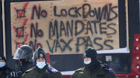 Police begin to break up a protest organized by truck drivers opposing vaccine mandates on February 18, 2022 in Ottawa, Ontario, Canada.