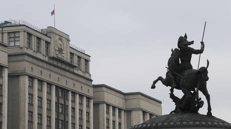 FILE PHOTO: The statue of George the Victorious faces the State Duma of the Russian Federation.