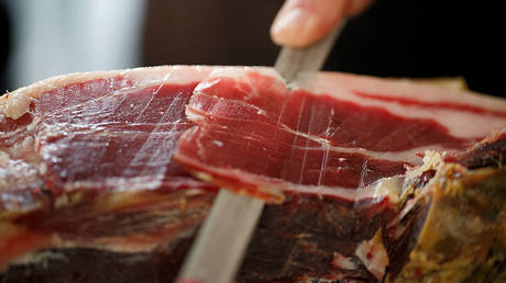 File photo: Jamon Iberico de Bellota is sliced during a competition in Madrid