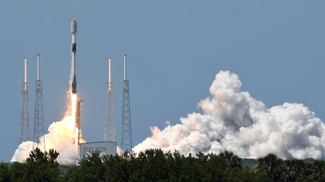 FILE PHOTO.  A SpaceX Falcon 9 rocket lifts off carrying approximately 60 Starlink satellites.
