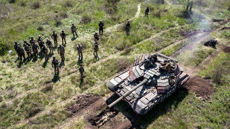 In this aerial view, A Ukrainian Army tank drives over an infantryman during a training exercise on May 09, 2022 near Dnipropetrovsk Oblast, Ukraine.