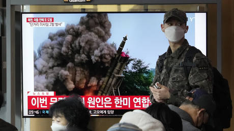 A TV screen shows a file image of North Korea's missile launch during a news program at the Seoul Railway Station in Seoul, South Korea, February 20, 2023