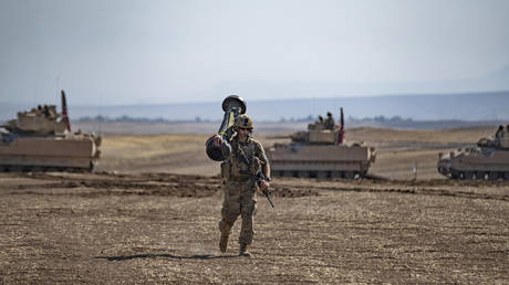 FILE PHOTO: A US soldier carries a Javelin anti-tank weapon in al-Malikiya, Syria, September 2022.