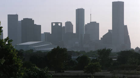 FILE PHOTO: Hazy smog blankets Houston, TX, June 26, 2000 during a hot summer day.