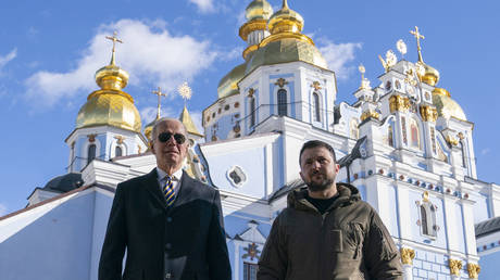 Joe Biden walks with Vladimir Zelensky at St. Michael's Cathedral in Kiev, Ukraine, February 20, 2023