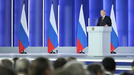 Russian President Vladimir Putin delivers his annual address to the Federal Assembly, including lawmakers of the State Duma, members of the Federation Council, regional governors and other officials, in Moscow, Russia.