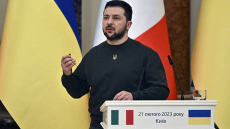 Ukrainian President Vladimir Zelensky gestures as he speaks during a joint press conference with Italian Prime Minister on February 21, 2023.