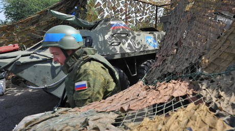 FILE PHOTO: A Russian peacekeeper at the checkpoint near the entrance to the town of Bender.