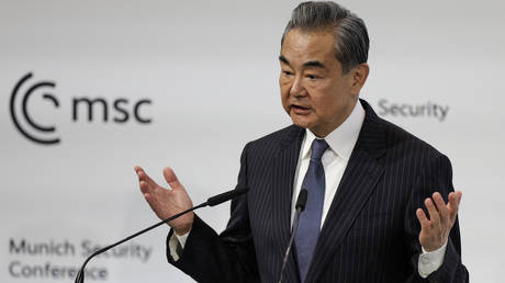 FILE PHOTO: China's Director of the Office of the Central Foreign Affairs Commission, Wang Yi, delivers a speech in Munich, Germany, on February 18, 2023.
