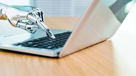 FILE PHOTO. Robot typing on keyboard