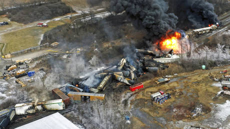 FILE - In this photo taken with a drone, portions of a Norfolk Southern freight train that derailed the previous night in East Palestine, Ohio, remain on fire at mid-day on Feb. 4, 2023.