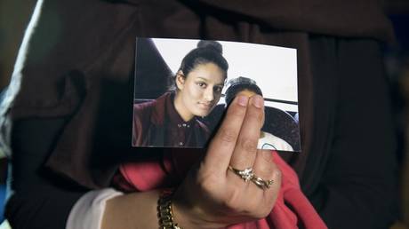 FILE PHOTO: Shamima Begum's elder sister holds a photograph of Shamima in London, Britain, February 22, 2015