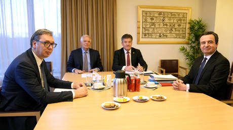 Serbian President Aleksandar Vucic, left, and Kosovo's Prime Minister Albin Kurti, right, meet with European Union foreign policy chief Josep Borrell, second left, in Brussels, February 27, 2023